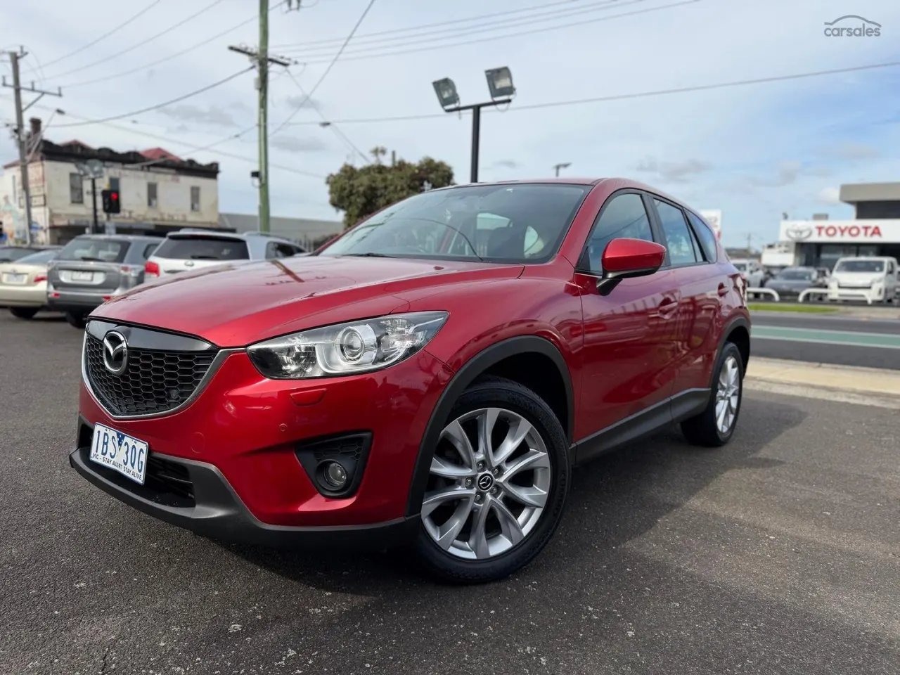 Red 2013 Mazda CX-5 parked on The Car Garage AU yard, High Street Preston